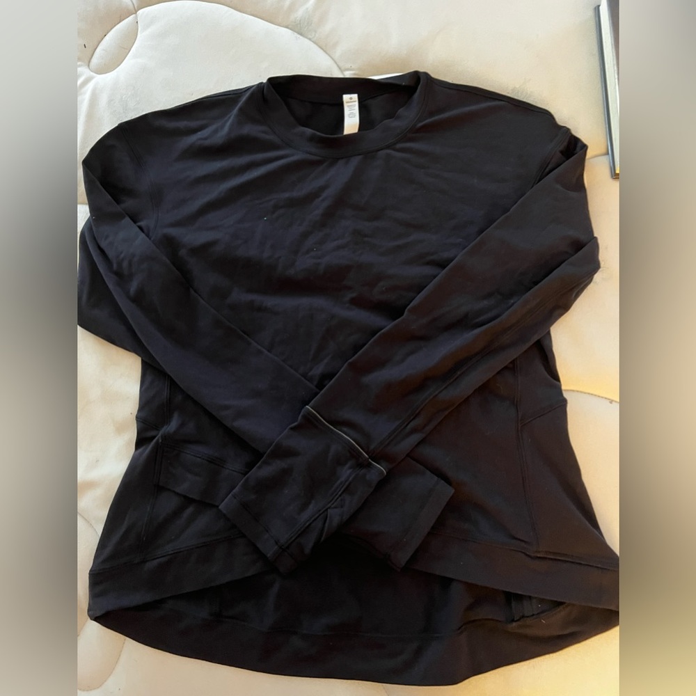 Lululemon, used like new. Thumbs holes, zip pocket in back, size Large.